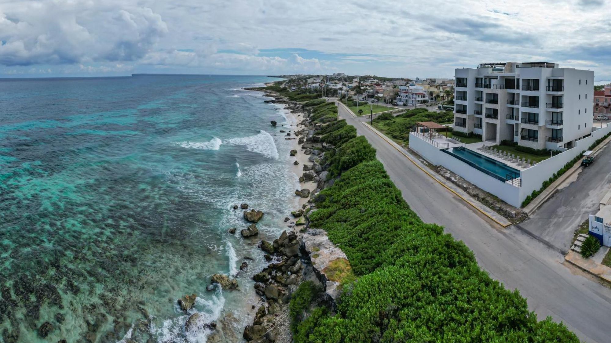 Sierra_Mar_Isla_Mujeres_Luxury_Oceanfront_Apartments_Mexico_Architecture.webp